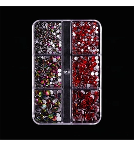 Detailed view of AB crystals and red rhinestones in a 6-grid nail art storage box