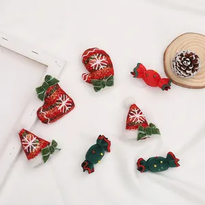 Christmas felt ornaments featuring stockings, gloves and candy with white snowflakes