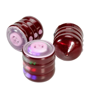 Colorful musical light-up spinning top toy in deep red finish for children's play