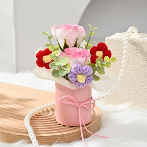 Pink cylinder flower bucket with soap roses and knitted flowers for holiday gifting