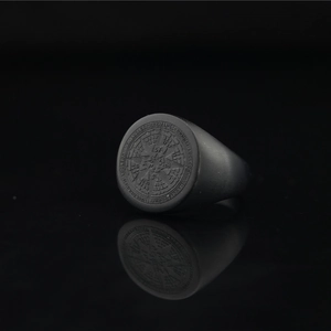 Matte black titanium steel signet ring featuring octagonal star compass engraving