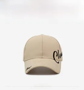 Front view of beige open top sun hat with black embroidery detail for outdoor running