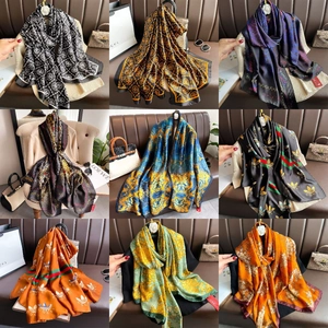 Detailed grid display of silk scarves featuring various luxury patterns and elegant colors