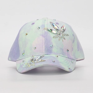 Front view of children's tie-dye baseball cap with sparkling rhinestone leaf patterns