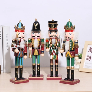 Detailed close-up of four wooden nutcracker soldier figurines for Christmas decor