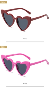 Side view of heart-shaped sunglasses in dark red and bright pink glitter finishes