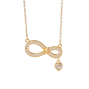 Elegant gold infinity necklace with heart pendant and cubic zirconia stones on white background