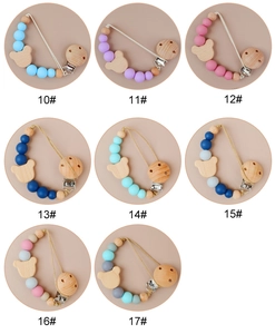 Detailed grid of silicone baby pacifier clips with wood bear beads in 8 color variants