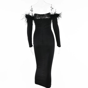 Detailed back view of a black bodycon dress featuring feather trim and a hidden zipper
