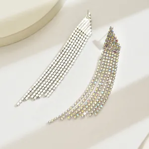 Detailed close-up of long cascade tassel earrings with silver and AB crystal rhinestones