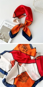 Detail of red and navy geometric square scarf with black rose line art print