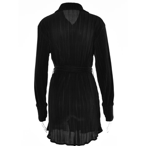 Back view of black pleated long sleeve shirt with tie waist and ruffled hem