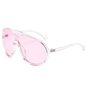 Pink oversized aviator sunglasses with transparent resin frames and heart detail on tips