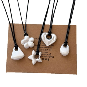 Minimalist brushed silver geometric pendant necklaces with heart, star and flower shapes
