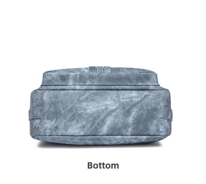 Macro detail of the durable denim crossbody bag base with reinforced stitching