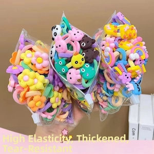 Detail of high-elasticity colorful nylon hair ties with cute cartoon resin charms in bags