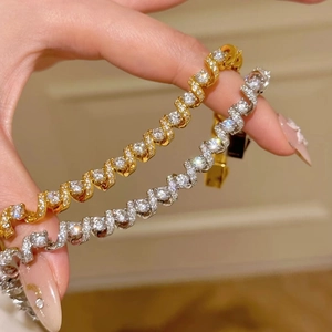 18K gold plated twisted spring bracelet with sparkling zircons in gold and silver finish