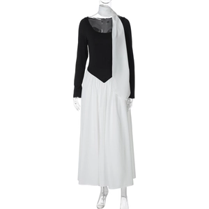 Detailed view of black off-shoulder top and white maxi skirt set with matching neck scarf