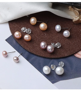 Detail view of multi-colored natural freshwater pearl earrings with S925 silver pins