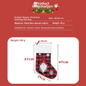 Detailed view of red and black plaid Christmas stocking with gnome and snowflake embroidery