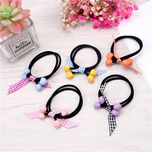 Set of 5 cherry-themed elastic hair ties with colorful plaid ribbons on wooden background