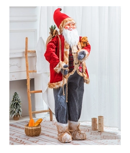 Standing Santa Claus figure with gift bag in a cozy indoor Christmas living room setting