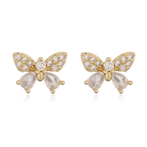 Macro detail of 18K gold plated bow earrings with sparkling cubic zirconia inlay