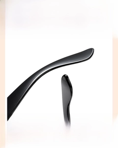 Detail of curved ergonomic temples on black kids' sunglasses for non-slip comfort
