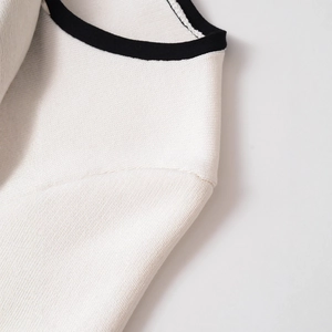 Women's short sleeve knit top with white contrast trim and textured crew neck