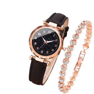 Elegant rose gold star-patterned watch with leather strap and matching crystal bracelet