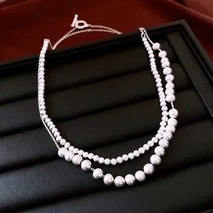 Double-layered silver beaded necklace with elegant T-bar toggle clasp on black leather