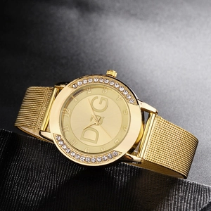 Luxury gold women's quartz watch featuring rhinestone-set bezel and comfortable mesh strap