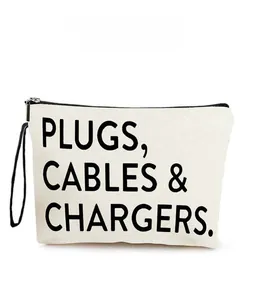 Detail of canvas electronics bag with Plugs Cables & Chargers text and black zipper