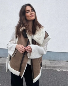 Detail of Y2K brown suede vest with off-white fleece lining and large lapel collar