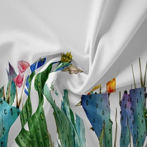 Detailed close-up of bohemian fabric showing vibrant watercolor cactus and floral prints