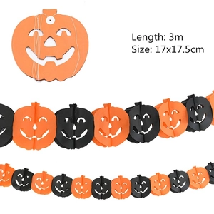 Close-up of 3m Halloween honeycomb pumpkin paper garland in orange and black for parties