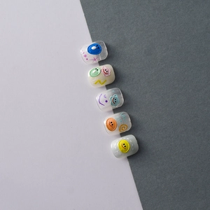 Detail of 5D daisy and smiley face embossed nail art stickers with 3D cartoon textures