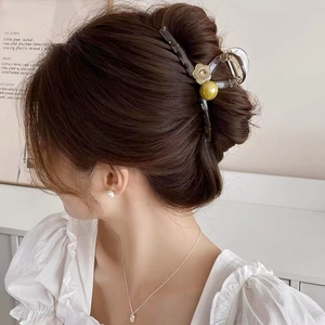 Elegant jelly flower hair claw clip with pearl on dark tortoiseshell for bun hairstyles