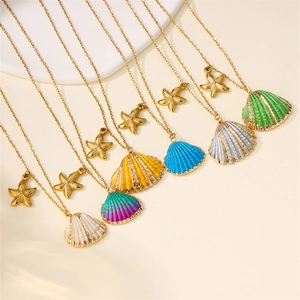 Elegant gold chain necklace with colorful shell and starfish charms for beach vacation style
