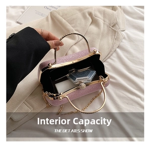 Close-up of shiny purple evening bag with gold handle and interior storage details