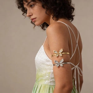 Metallic butterfly upper arm cuff with rhinestones in gold and silver finish