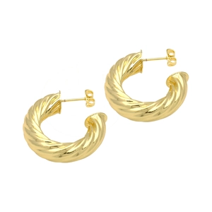 Detailed view of gold plated twisted rope hoop earrings with glossy metallic texture