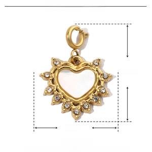 Detail of 15x20mm gold heart pendant with shell inlay and rhinestone accents