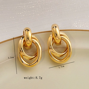 Detailed view of triple intertwined gold-plated hoop earrings showing 3.2cm height and dimensions