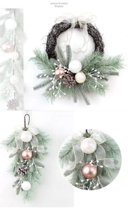 Detail of flocked Christmas wreath and teardrop swag with pink baubles and pine cones