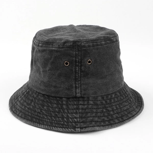 Close-up of vintage washed cotton bucket hat showing metal eyelets and stitched brim