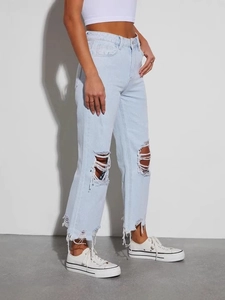 Jeans in denim azzurro vintage da donna a gamba larga con strappi sulle ginocchia