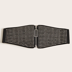 Detail of black wide elastic corset belt with silver rivets and front zipper closure