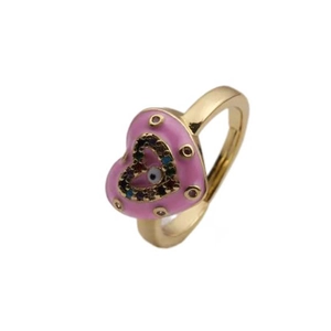 Pink enamel heart ring with gold plating and evil eye zircon, 45-degree angle view