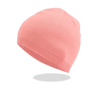 Close-up of pink winter beanie showing detailed fine-knit texture and ribbed cuff
